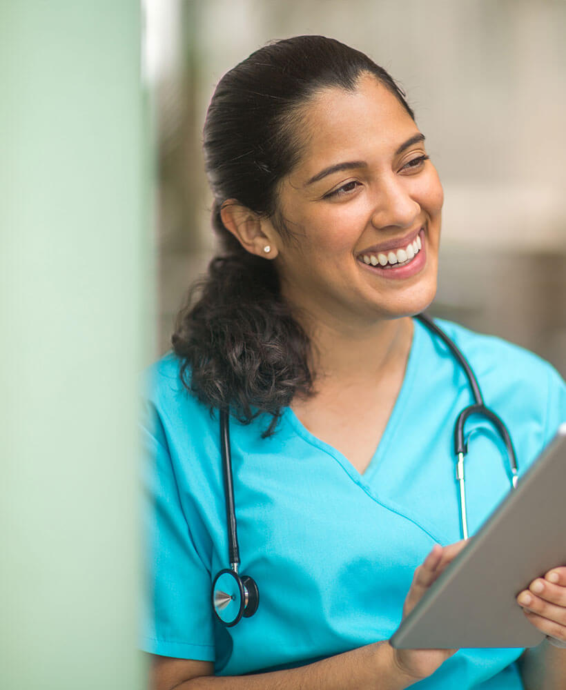 provider with stethoscope and tablet