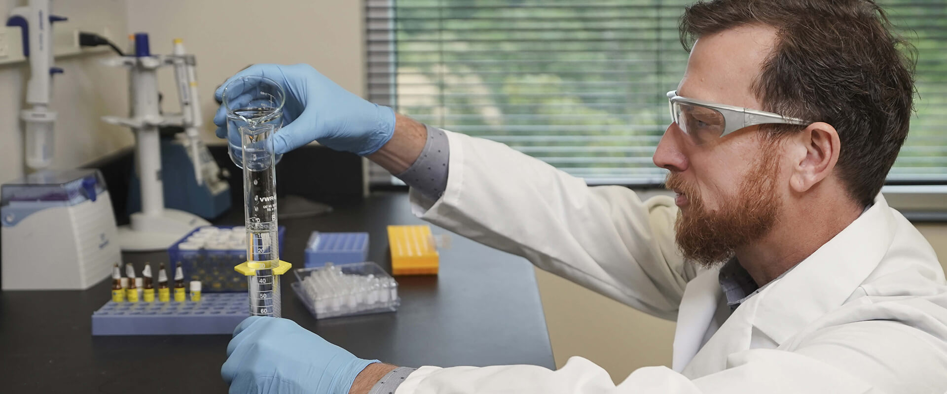 Researcher measuring a sample