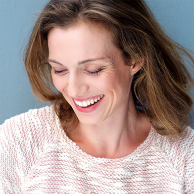 smiling woman looking down