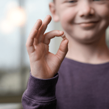 boy holding tooth