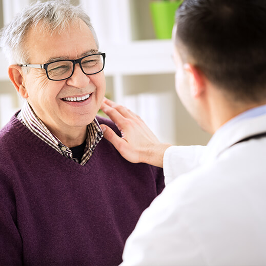 smiling man with doctor