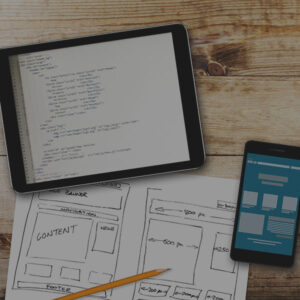 website mockups laying on a table