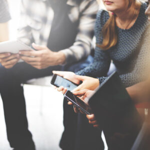 group of people on mobile phones and tablet