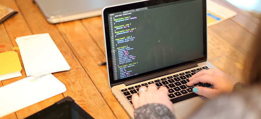Website manager making updates on the computer