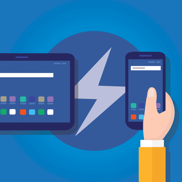 Hand holding mobile device with AMP logo background