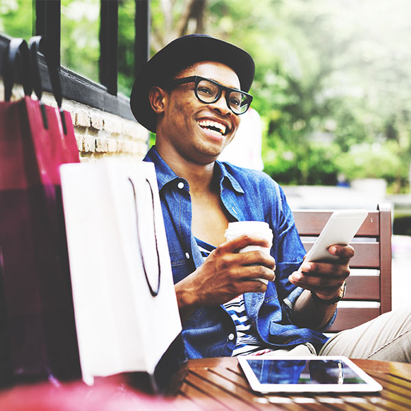 man on phone with shopping bags