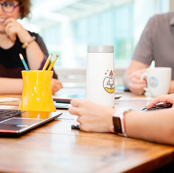 marketing agency team meeting around a table