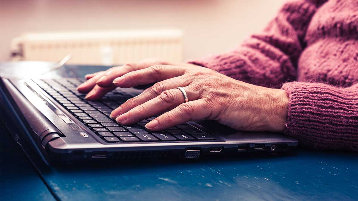 elderly woman browsing the internet for a healthcare provider