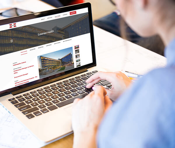 Person looking at laptop with Hagerman website