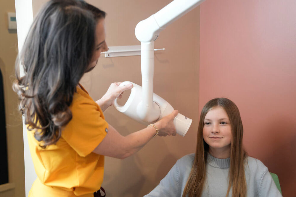 Young teen getting dental x-ray