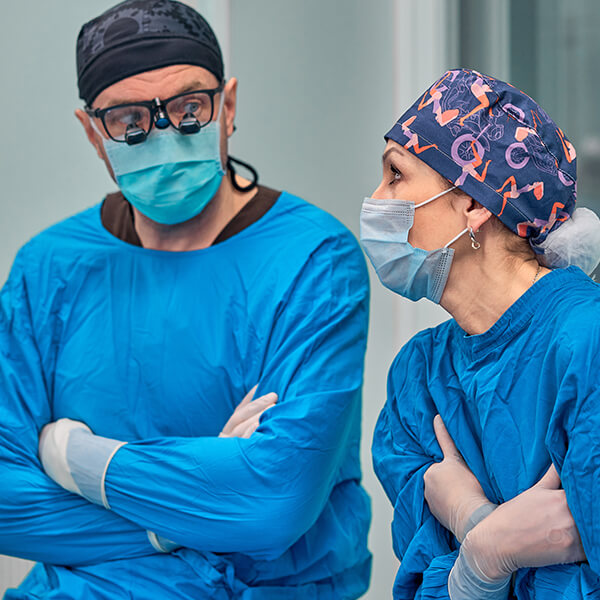 between seeing patients, two doctors discuss the benefits of hiring an agency for healthcare marketing consulting