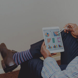 man reviewing marketing budget on a tablet