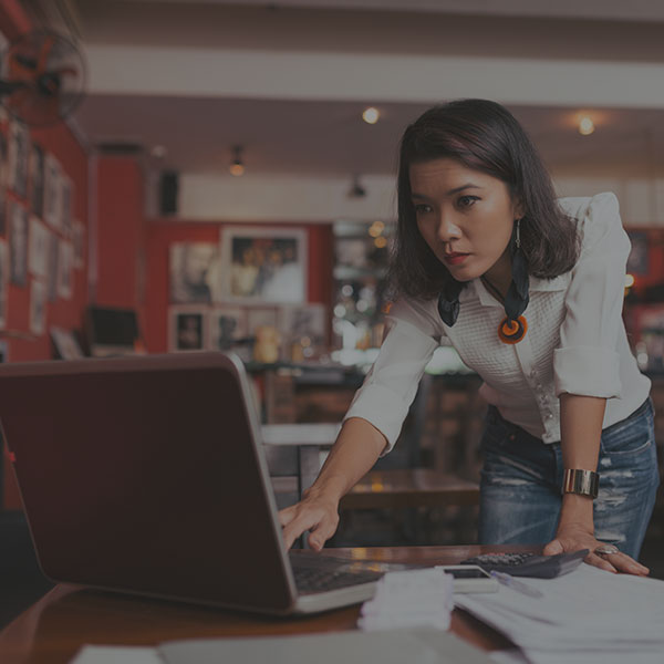 Business owner researching on computer