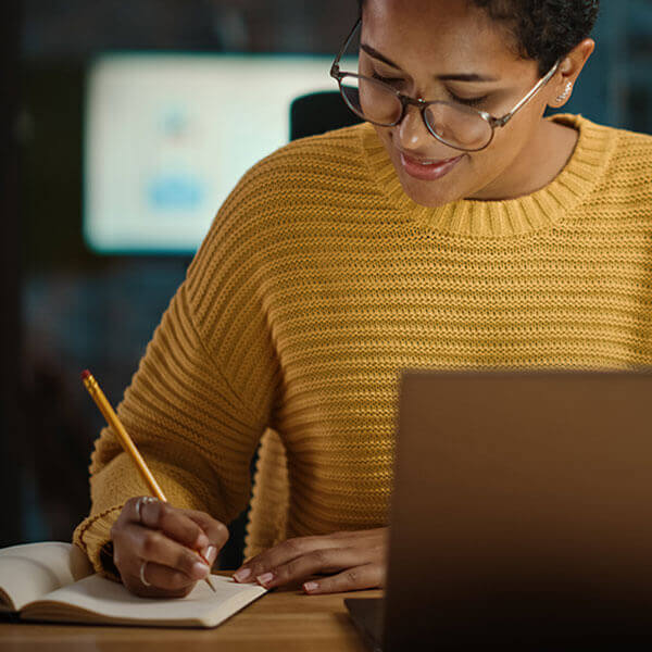 marketer using inclusive writing while drafting ideas for marketing campaign