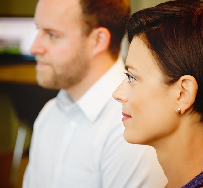 Team members listening in a meeting