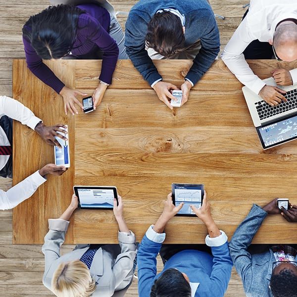 overhead view of team using technology