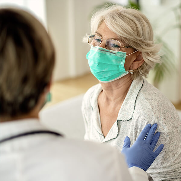 patient speaks with her medical provider, whom she found via senior healthcare marketing tactics