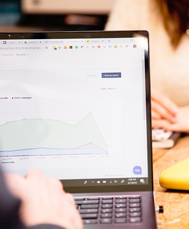 marketer viewing site analytics on laptop