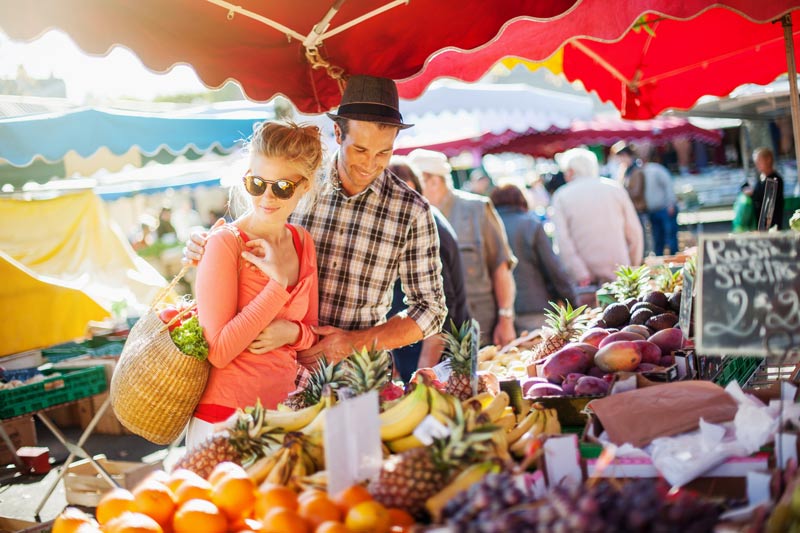 Young couple shopping at market