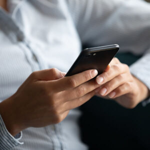 woman using phone to look at social media