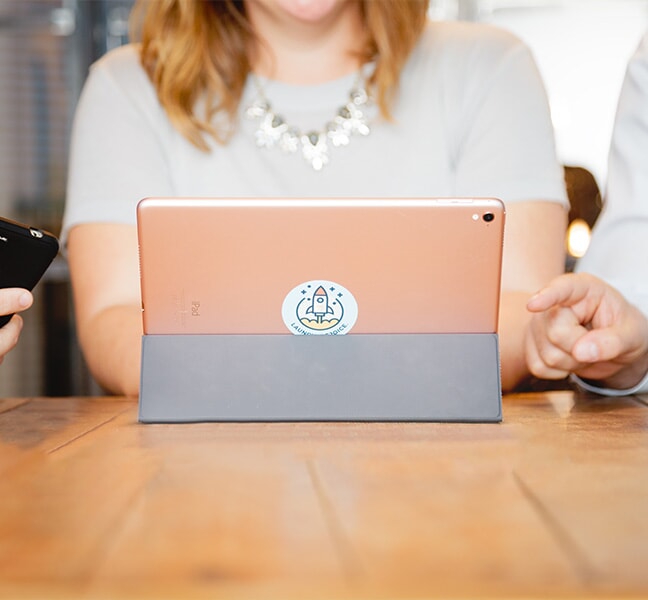 Woman working on tablet during meeting