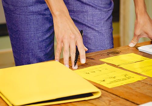 TBH team member sketching website and presenting to team ideas