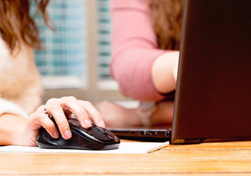 TBH team in meeting with computer and focus on mouse