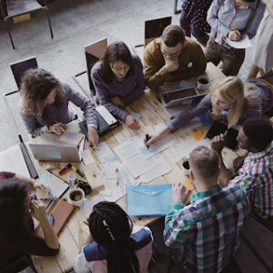 team working on a website redesign at a table