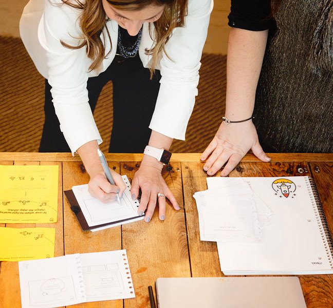 TBH team sketching wireframes