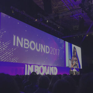 HubSpot Inbound conference stage with screen showing Inbound 2017 logo