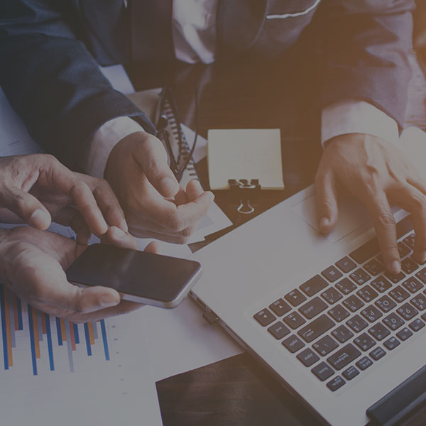 Business men discussing reports and performance