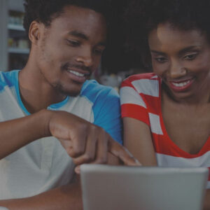Man and woman reading on tablet